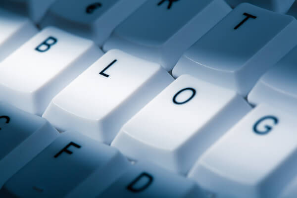 blog concept image on computer keyboard with lightray