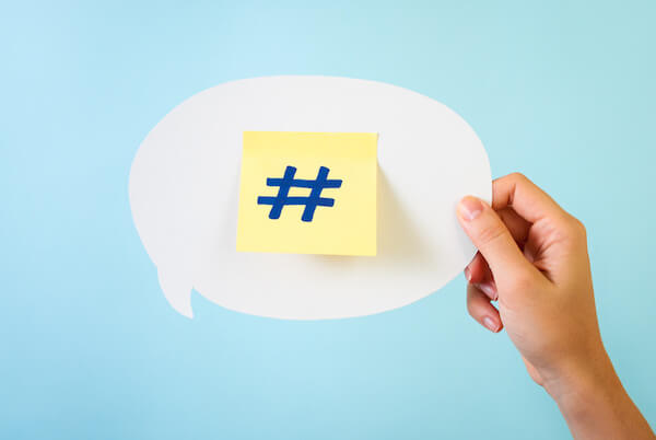 Social media hashtag on blue background